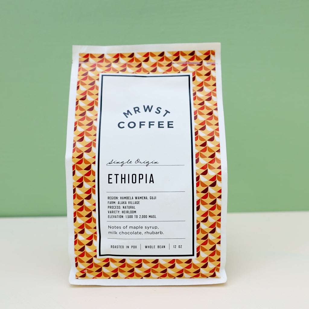 bag of Ethiopian coffee on a green and white backdrop.